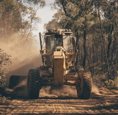 Grader working on a dirt road
